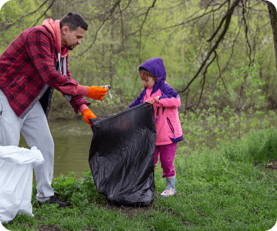 Dad and daughter with garbage bags clean environment